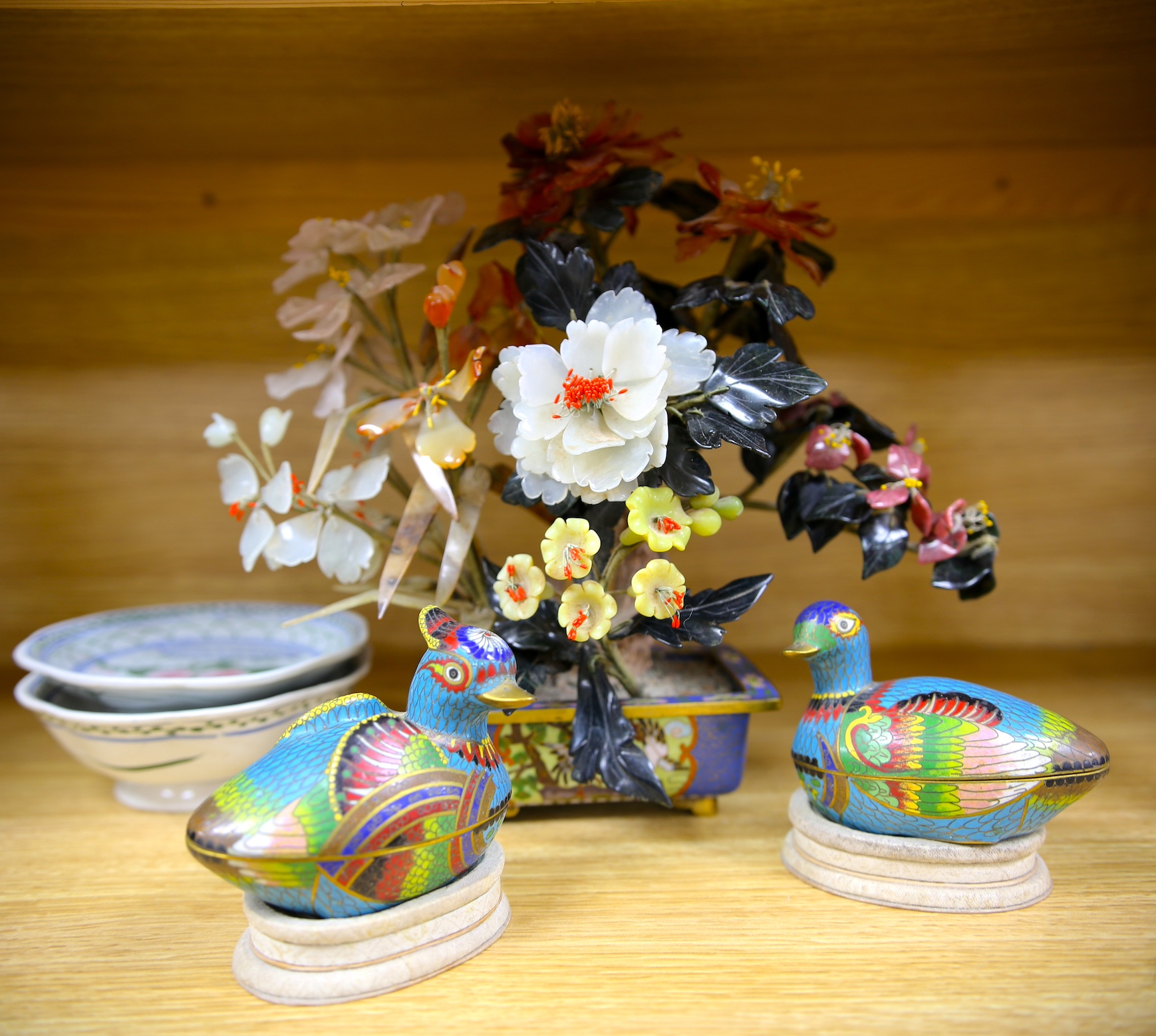 Five Chinese items including a pair of cloisonné enamel duck boxes and covers, a hardstone floral display and two dishes, largest 30cm. Condition - fair